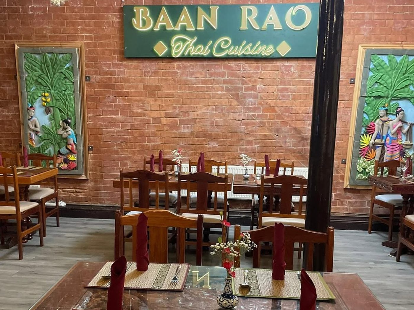 The Baan Rao Thai Cuisine sign above the dining tables